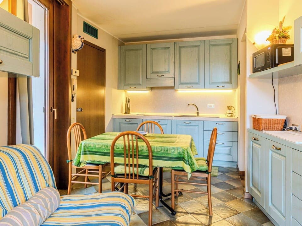 Furniture, Interior Design, Flooring, Wood, Floor, Ceiling, Countertop, Kitchen, Room, Cabinetry