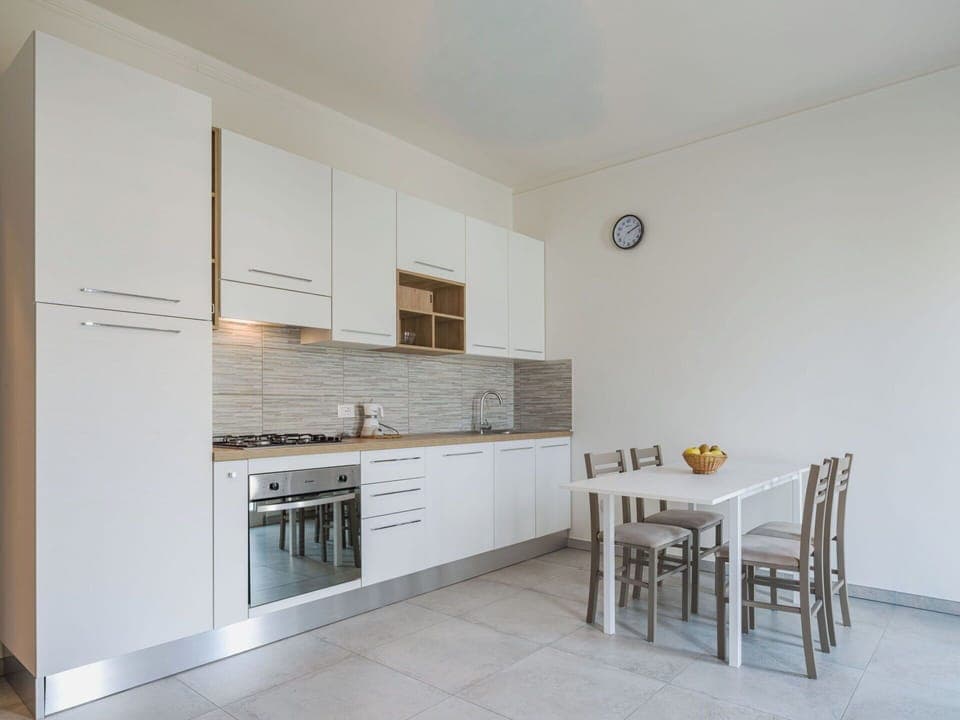 Furniture, Flooring, Interior Design, Wood, Floor, Kitchen, Kitchen Appliance, Major Appliance, Countertop, Ceiling