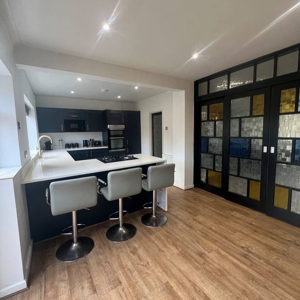 Open-plan kitchen with breakfast bar