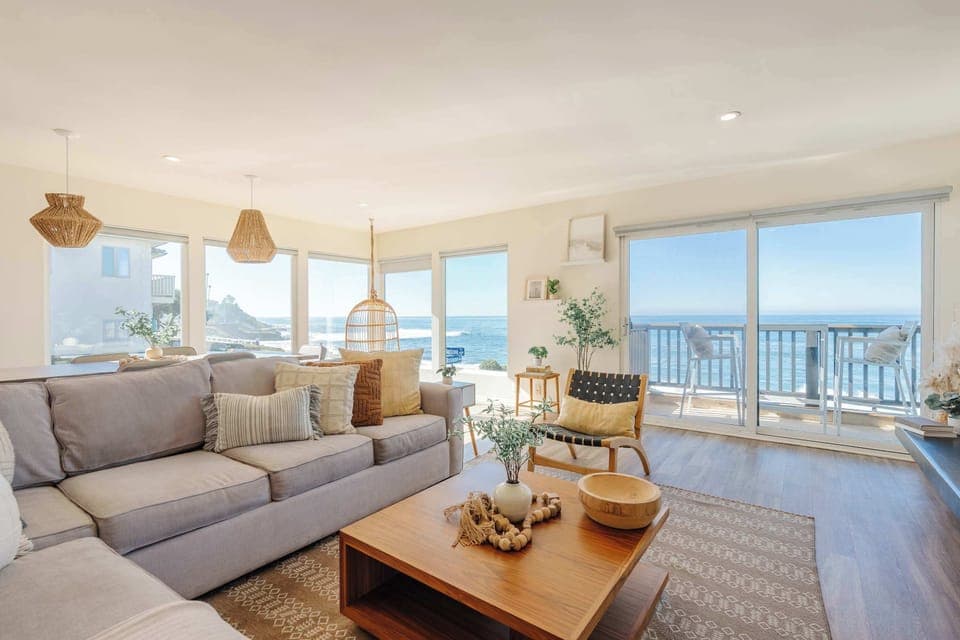 Enjoy stunning coastal views from this stylish living room.