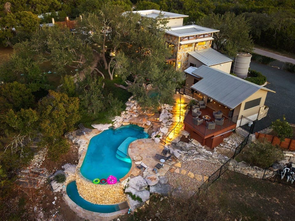 A stunning aerial view of Lariat Springs at dusk. Enjoy our pool and hot tub!