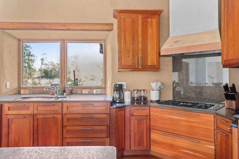 Even the morning ritual is elevated by the view; watch the resident ducks on the natural pond directly from the kitchen sink.