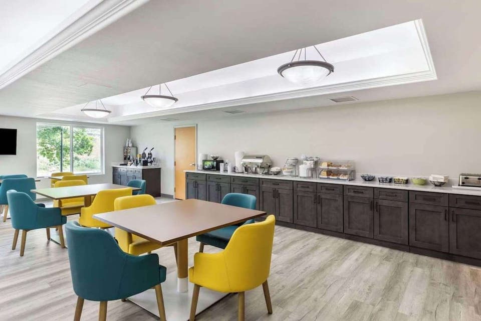 Dining room with colorful chairs and long breakfast counter