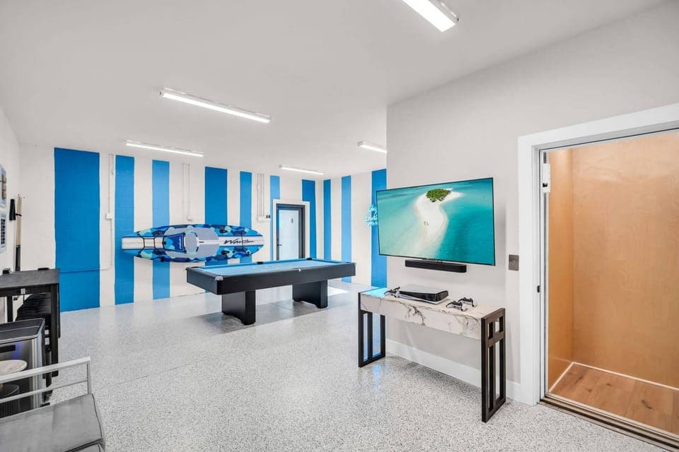 Ultimate game room. Pool table, Play Station, Basketball, Darts, Magnetic Board Games, Roku TV and a Sonos Sound System! Elevator access for all 3 floors.