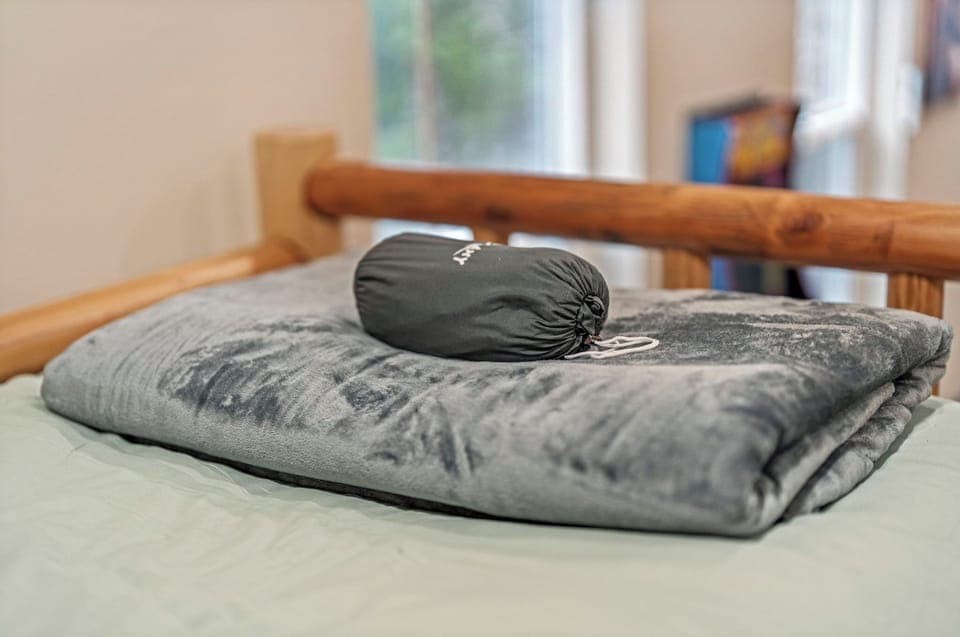 Top bunks include a cozy blanket and sleep sack for the littles in each group.