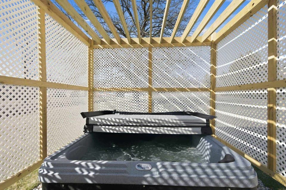 Soak, unwind, and enjoy the privacy of an enclosed hot tub
