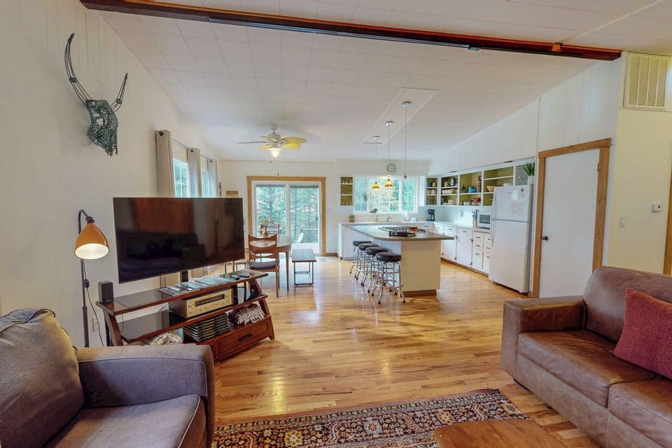 living room, looking into kitchen and dining room 