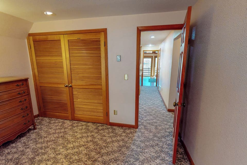 queen bedroom looking down the hall to living room