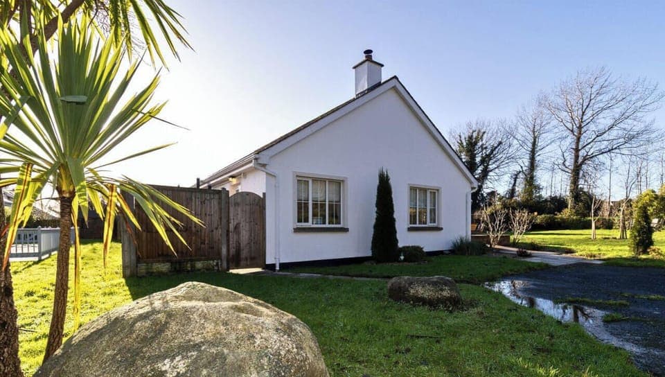 Brittas Bay Holiday Park No 7. Sunny exterior with large green area and spacious setting.