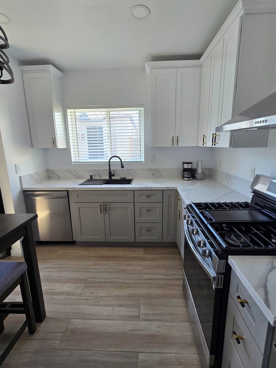 Full kitchen, loaded with stainless steel appliances.