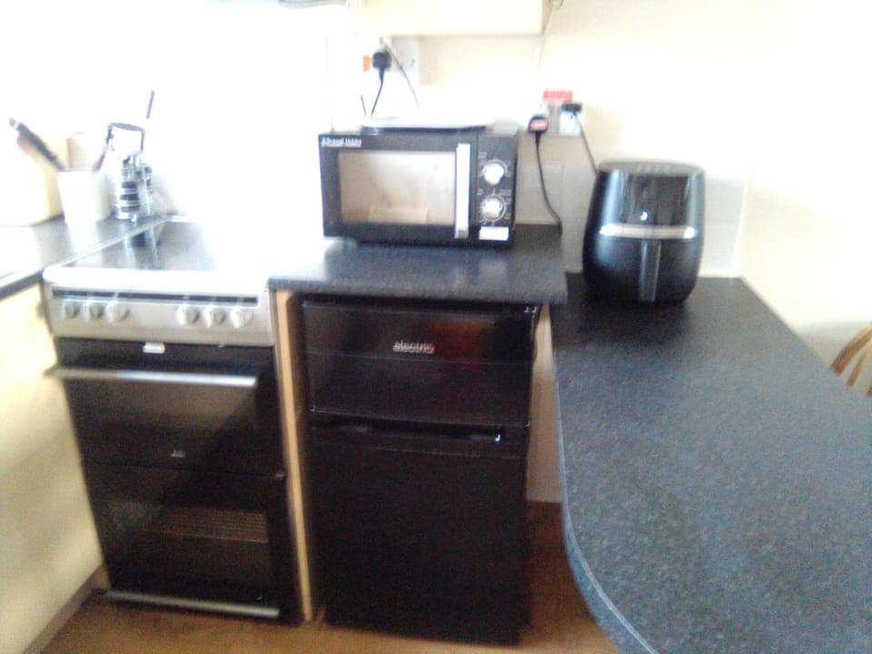 kitchen: new air fryer, microwave, double oven and hob, and new fridge freezer.