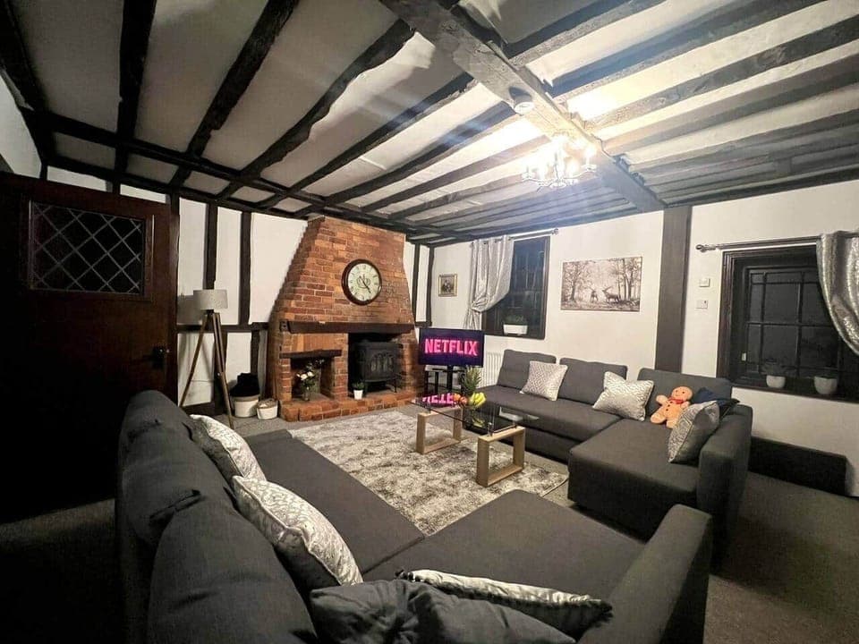 Escape to tranquility. This inviting living room is perfect for unwinding and connecting. Book your stay today Top Stay Hosts serviced accommodation.