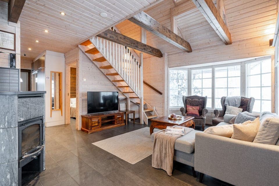 A cozy fireplace corner invites you to relax after a day spent outdoors