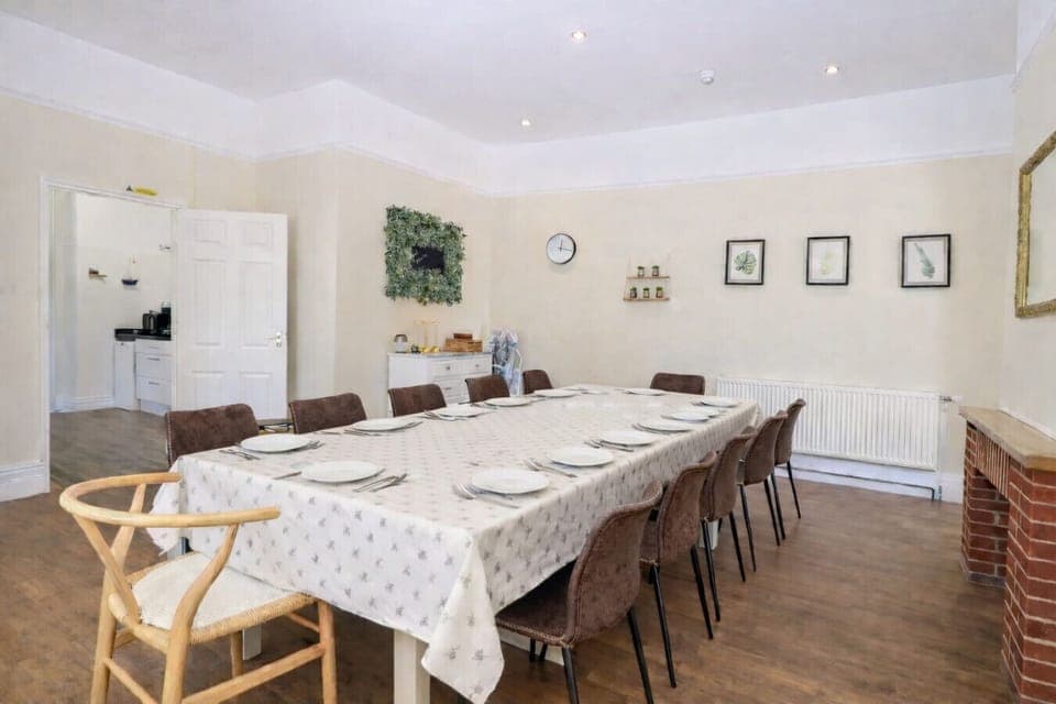 Long dining table set up for group meals.