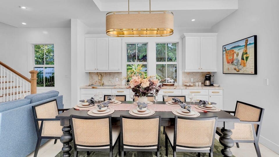 Gather around your elegant dining table for memorable meals in this beautifully appointed space with modern kitchen convenience.