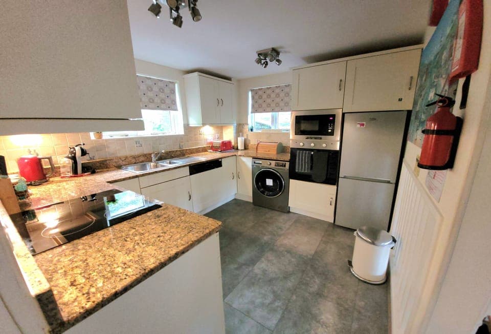 Langunnett Cottage, Looe. First Floor: The well-equipped kitchen