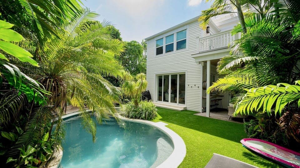 CASA DEL MONO is a stunning tropical retreat with crystal-clear pool nestled among lush palms...