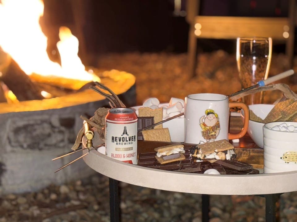 Fire Pit Delight: Indulge in s'mores under the stars with a refreshing drink in hand!