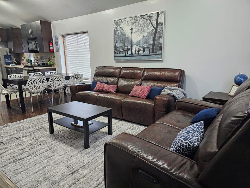 Upstairs Living Room with super comfy recliner sofa and love seat and 75"TV