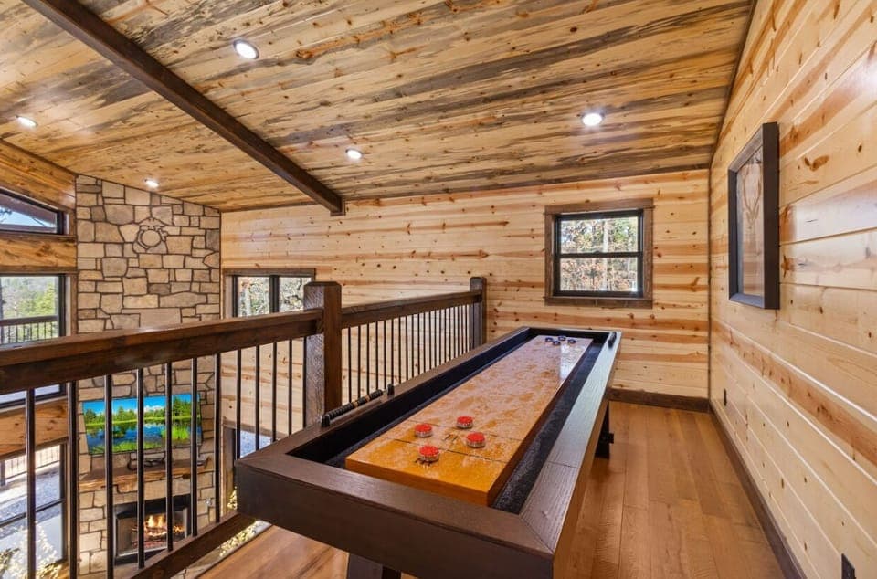 Go for a high score on the classic cocktail arcade table, tucked perfectly into this rustic corner.