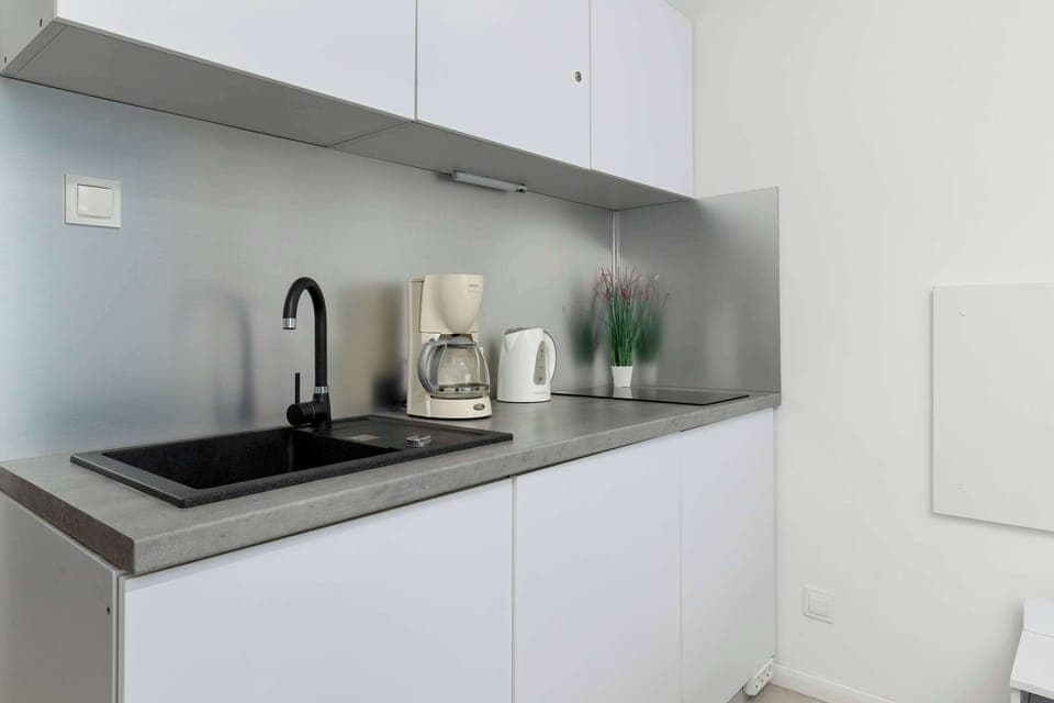 The kitchenette's practical layout maximizes space and functionality.