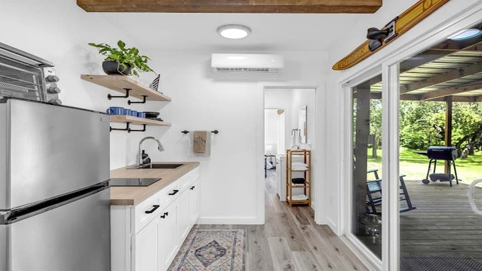 Light-filled kitchen with seamless access to the covered deck.