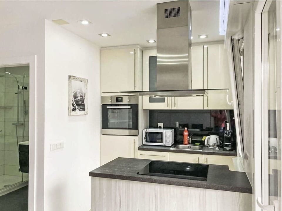 Kitchen, Kitchen Appliance, Countertop, Interior Design, Cabinetry, Furniture, Flooring, Major Appliance, Wood, Ceiling