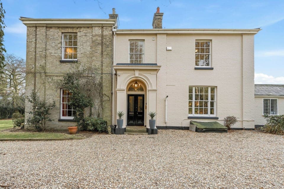 Grand entrance from Large gravel area with plenty of parking  for up to 5 cars.