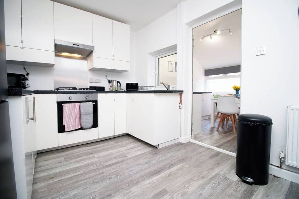 The fully equipped kitchen is ready for your culinary adventures, with everything you need to make delicious homemade meals. 