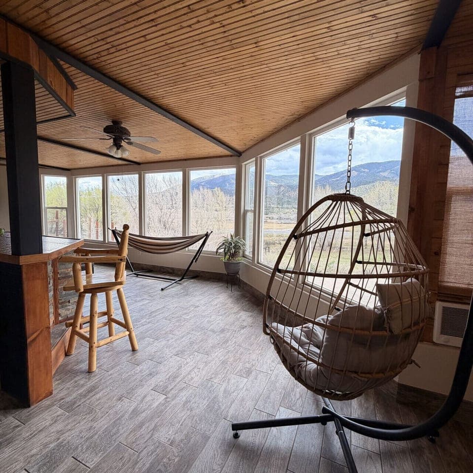 Sunroom with hammock and hanging chair