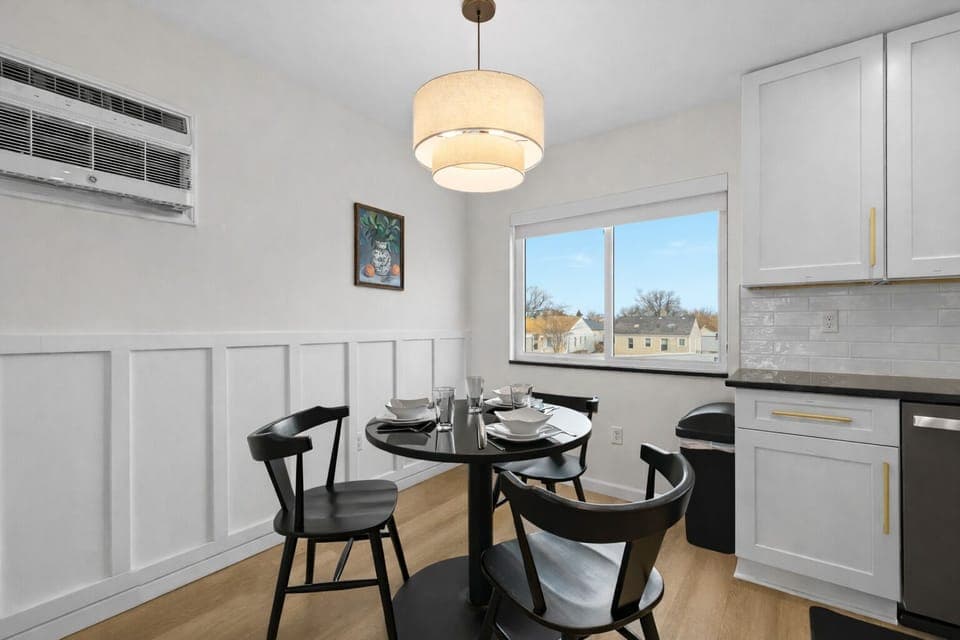 Enjoy meals in this bright, modern dining nook with stylish seating, warm lighting, and a cozy setup perfect for everyday dining.