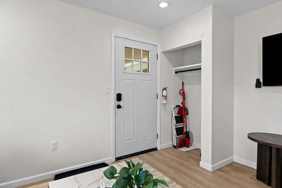 Clean, welcoming entryway with modern finishes, smart lock access, and convenient storage—making arrivals smooth, organized, and stress-free.