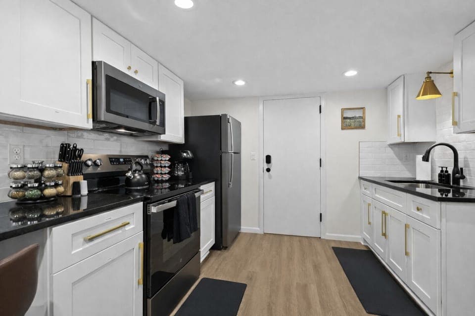 Bright, fully equipped kitchen with modern appliances, sleek countertops, and ample storage—perfect for cooking, prepping meals, and enjoying everyday convenience.