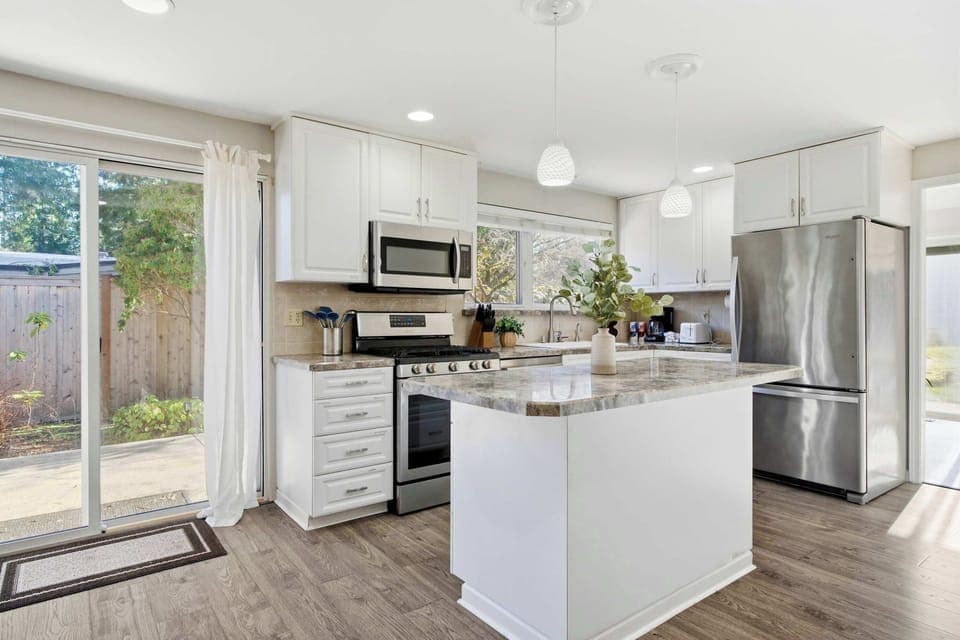 Fully equipped modern kitchen with sleek appliances, ample counter space, and everything you need to cook with ease.