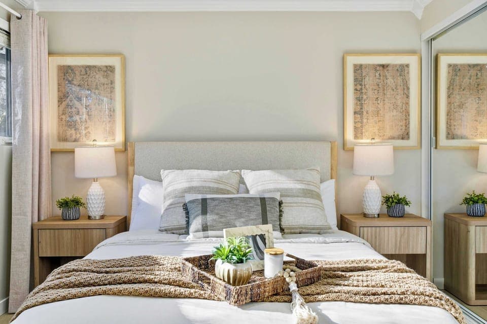 Serene bedroom featuring a plush bed, soft linens, and calming décor for a restful night’s sleep.