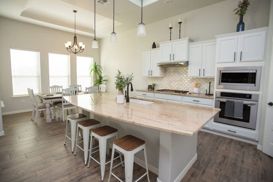 Kitchen area includes bar stools for additional seating 