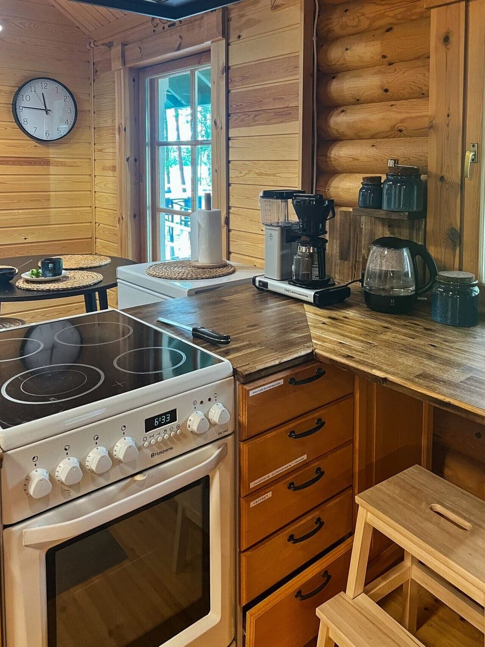 A fully equipped kitchen featuring a modern stove and a Moccamaster coffee maker for the perfect morning brew.