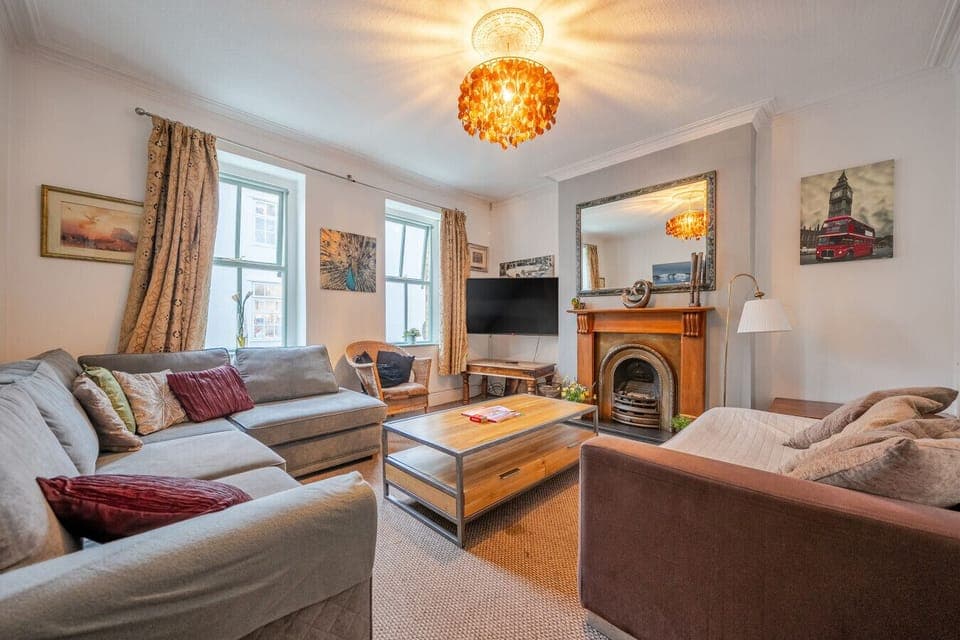 Settle into the main lounge with the fireplace and seating area for relaxing together