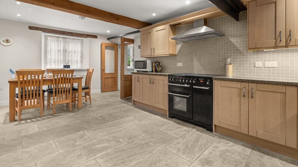 Arranged to suit your needs, the large kitchen has worktop space and cupboard storage in abundance.