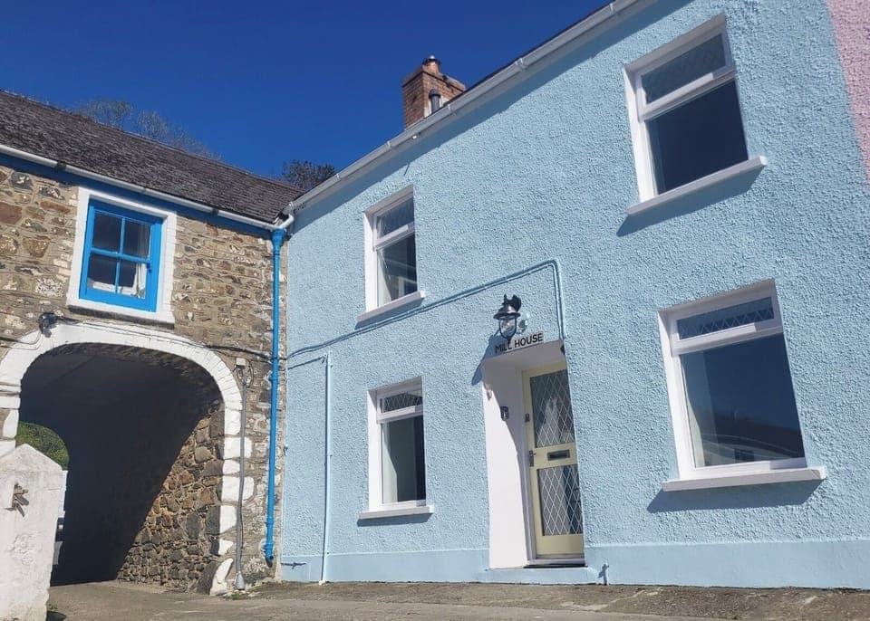 Enter the historic Mill complex through the arch to the courtyard and parking