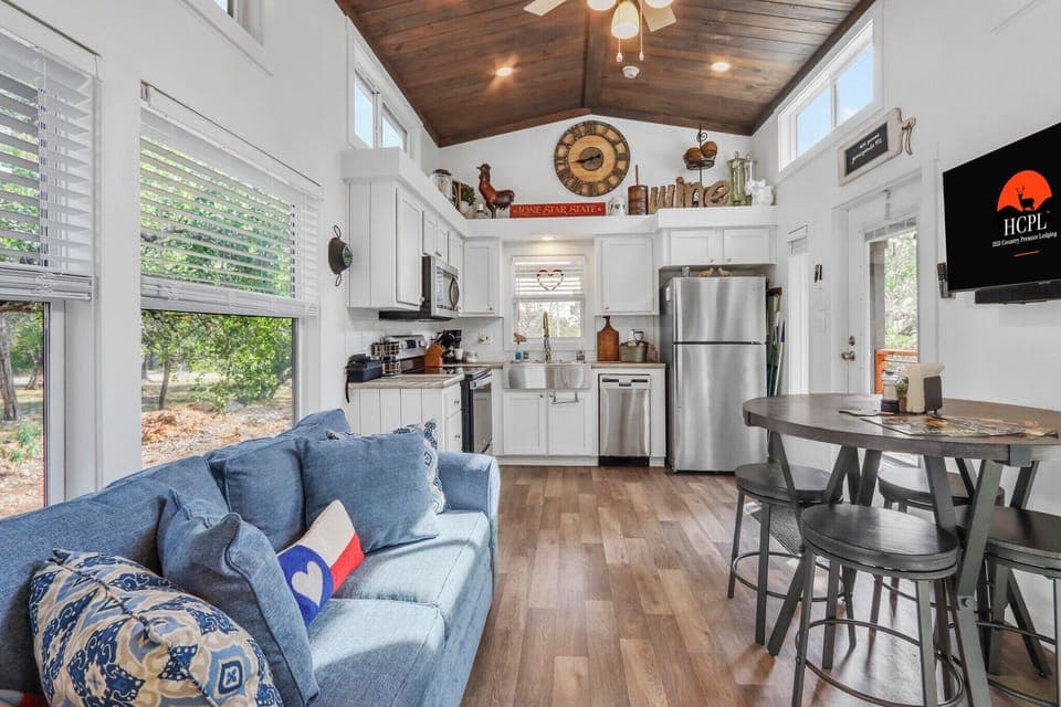 Cozy, but open floor plan with vaulted wood ceilings and a full kitchen