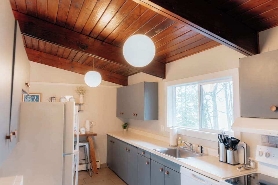 Fully equipped kitchen with ample counter space and everything you need for meals during your stay.