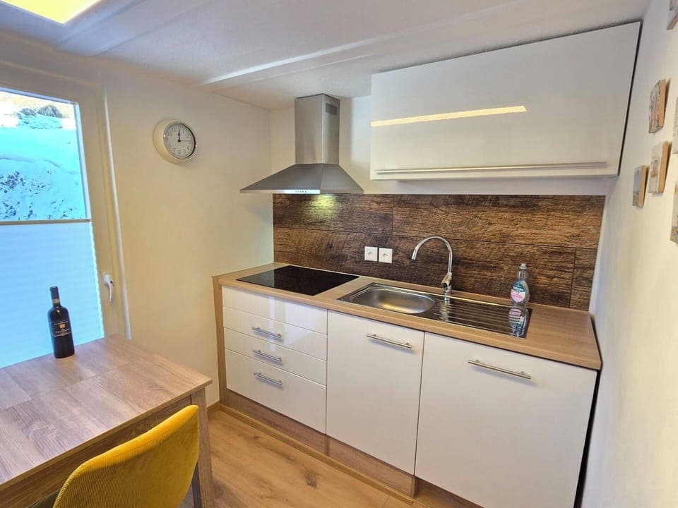 Countertop, Interior Design, Flooring, Cabinetry, Floor, Furniture, Plumbing Fixture, Kitchen, Wood, Sink