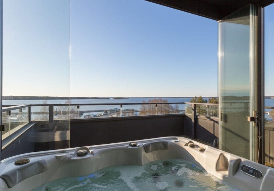 Unwind in style. Soak in the warm bubbles of your private rooftop hot tub while taking in breathtaking, unobstructed views of the lake