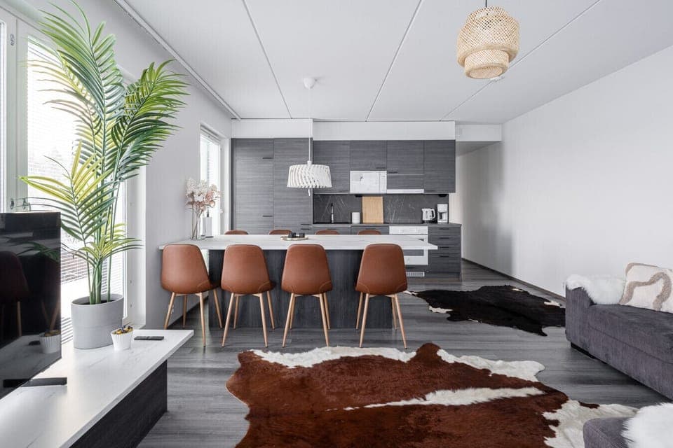 Experience true open-concept living. This expansive view showcases how the kitchen, dining, and living areas flow together, creating a bright and welcoming space perfect for groups or families.