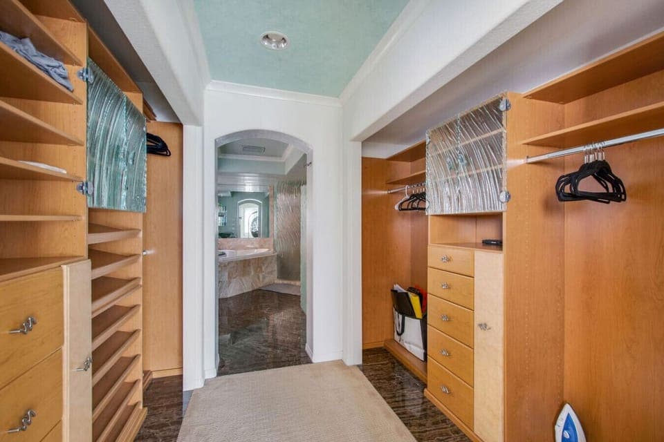 Spacious walk-in closet with custom storage
