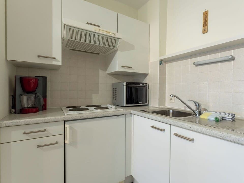 Kitchen Appliance, Kitchen, Countertop, Major Appliance, Cabinetry, Kitchen Stove, Flooring, Kitchen Sink, Interior Design, Stove