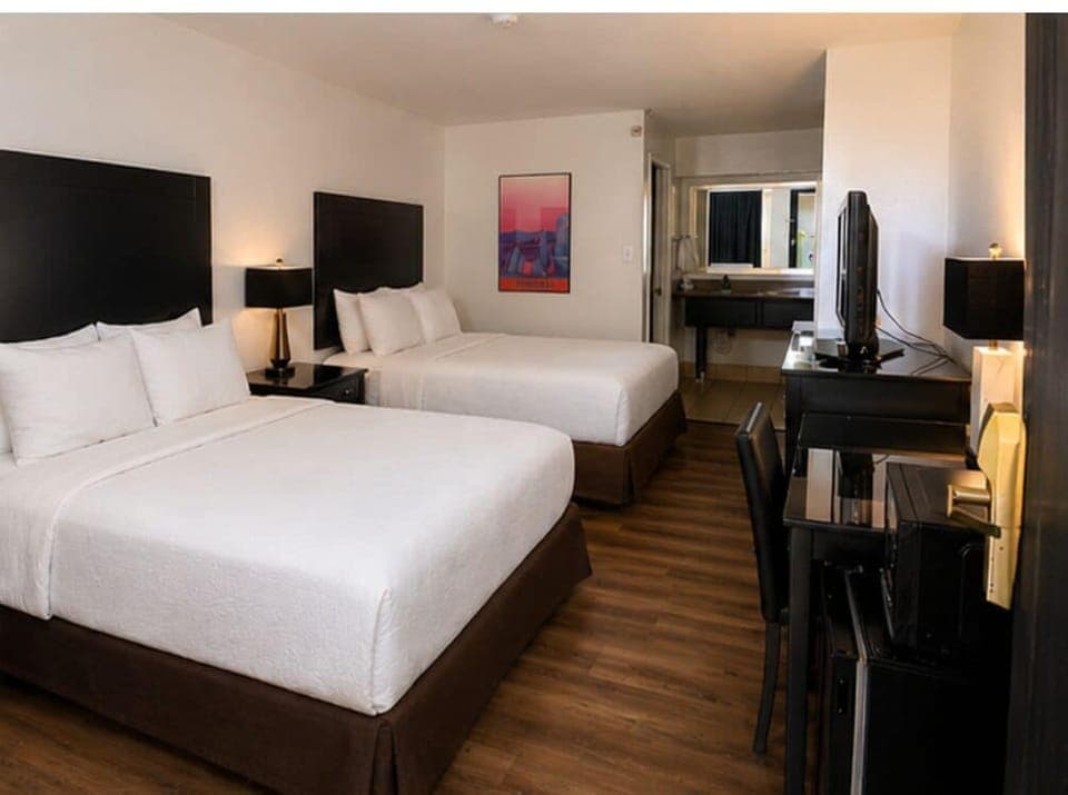 Standard Room, 2 Queen Beds, Pool View | Desk, laptop workspace, blackout drapes, free WiFi