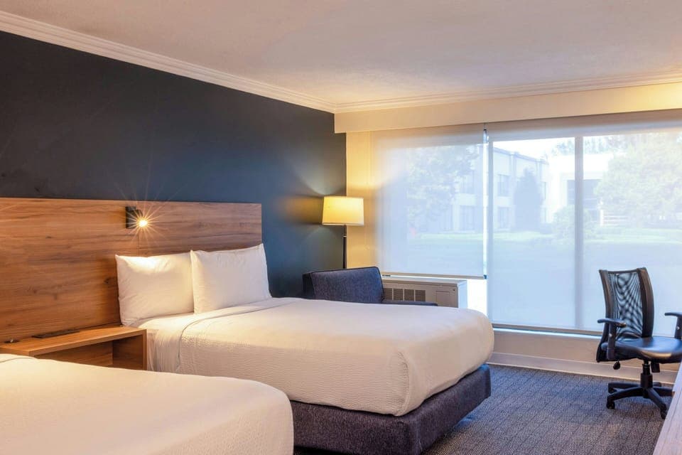 Room, 2 Double Beds | In-room safe, desk, blackout drapes, iron/ironing board