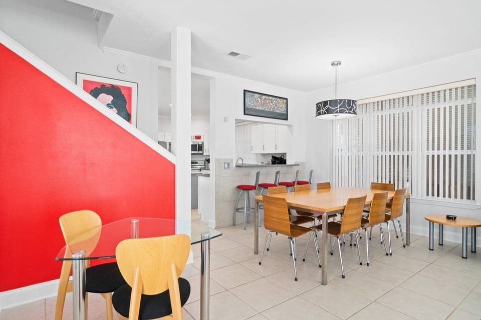 Open-concept living and dining space with stylish furnishings, perfect for relaxing and sharing meals together.